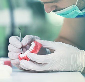 Lab technician working on denture