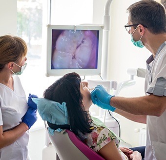 Dentist and patient looking at intraoral image