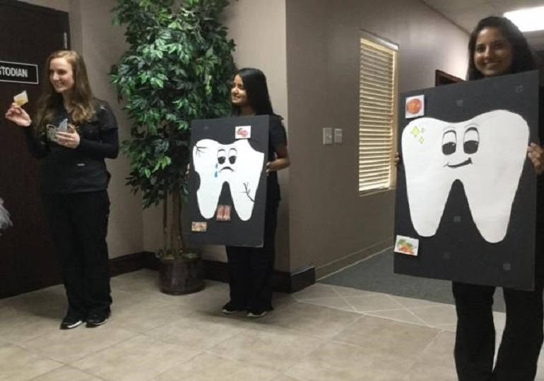 Team members teaching kids about oral health