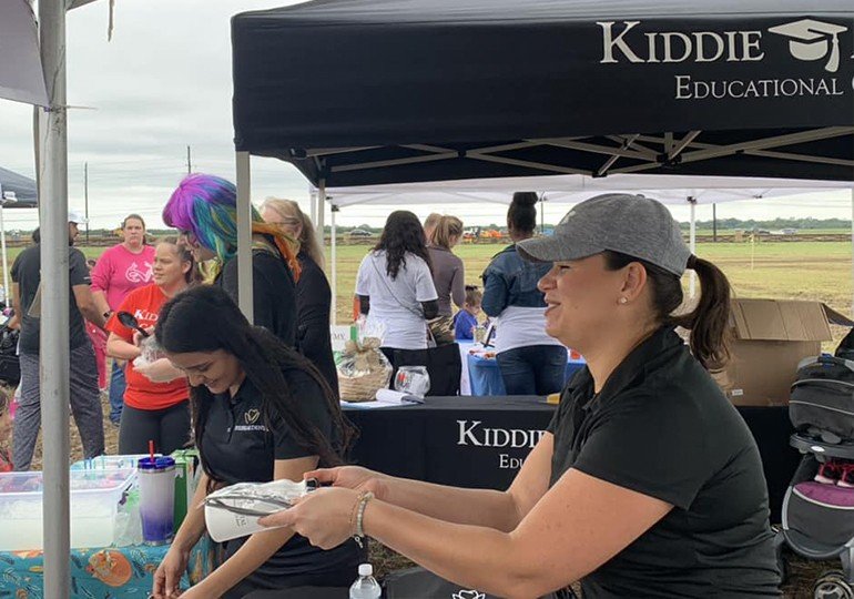 Team member handing out products at event