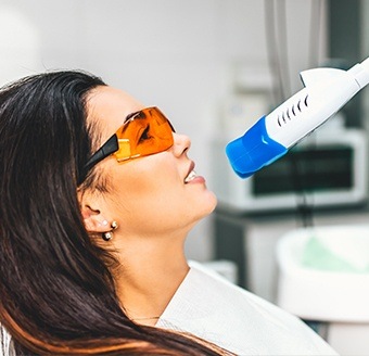 Woman receiving in-office teeth whitening