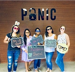 Team members holding up signs