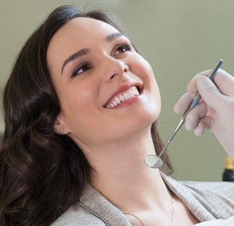 Woman receiving dental checkup