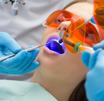 Patient receiving dental sealants