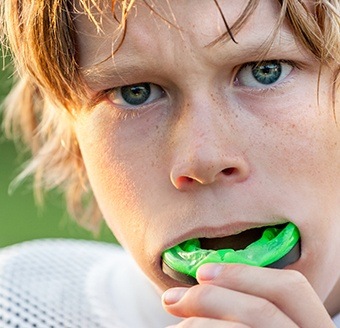 Teen placing sportsguard