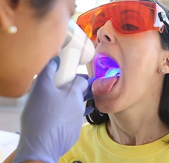 Patient receiving oral cancer screening