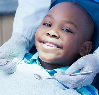 Smiling young boy in dental chair